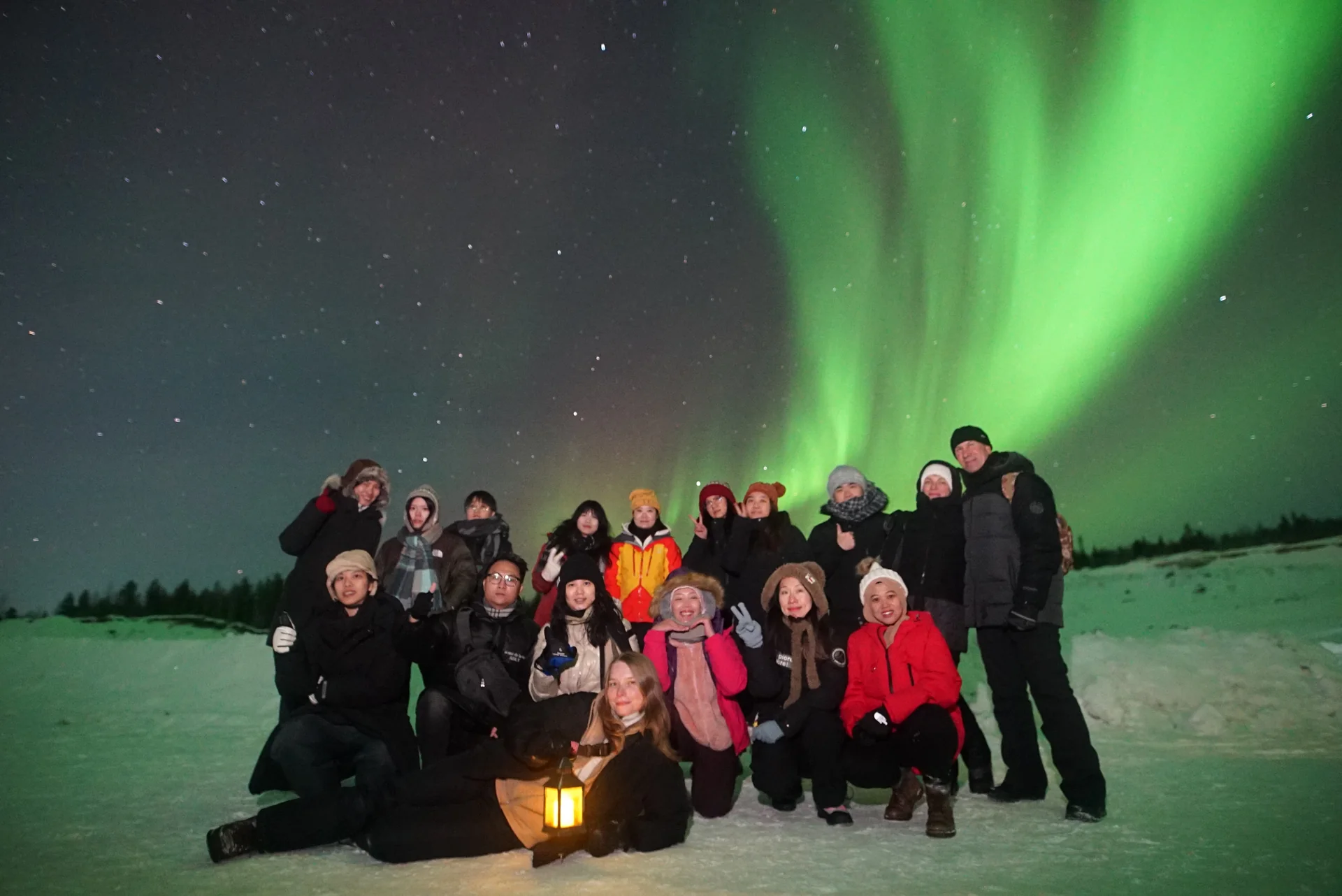 A group of travellers under the Northern Lights — Three Days in the North tour